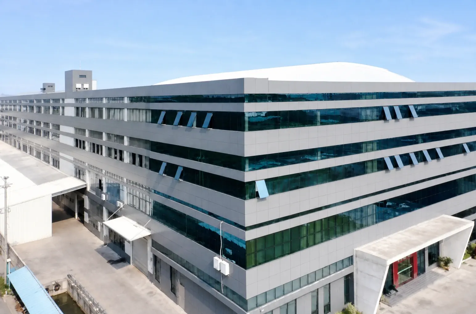 Elevated view of the factory exterior and its surrounding grounds